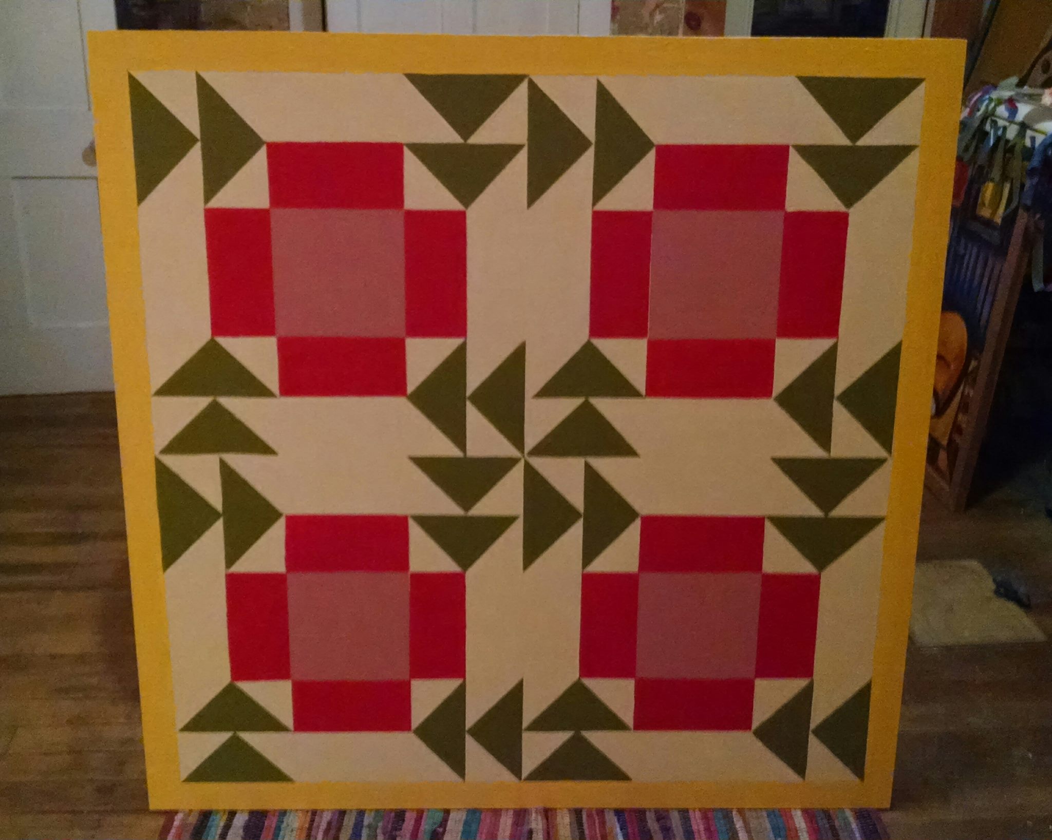 Image of a painting that looks reminiscent of a quilt